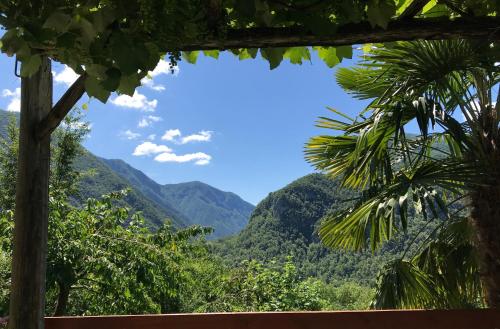 a view of the mountains from a house at Apartment Pri Bricu in Kobarid