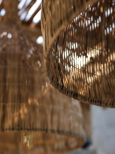 a close up of a wicker bench at Mimi and Coco Villas Corfu in Paramonas