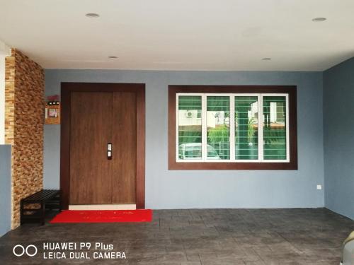 a room with a door and a window at Leisure homestay@Kota Kinabalu in Kota Kinabalu