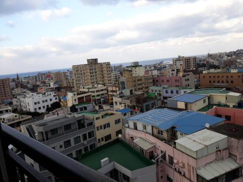 a view of a city with buildings at ARA Palace Hotel in Jeju