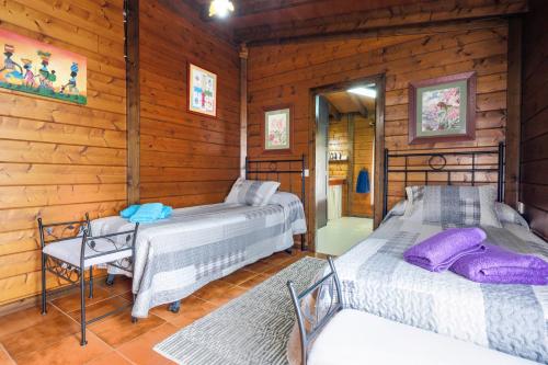 Säng eller sängar i ett rum på Casa Rural con piscina