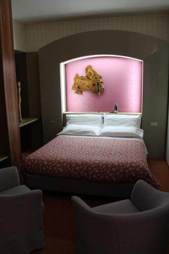 Katil atau katil-katil dalam bilik di Hotel Costellazioni