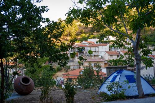 a blue tent sitting in front of a village at Retreat Centre Cyprus in Zoopiyi