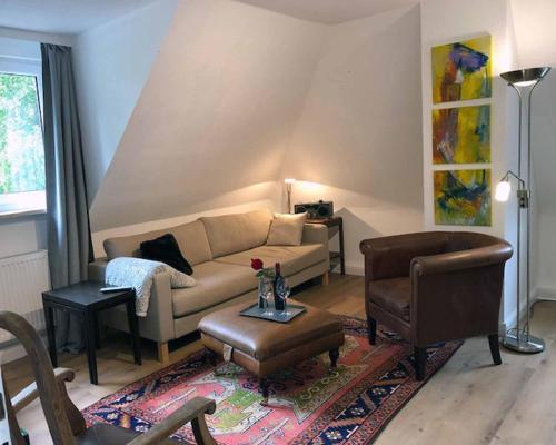 a living room with a couch and a table at Ferienwohnung Bartel in Coburg