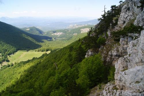 a mountain with a cross on the side of it at Tana Libera Tutti 3 Nature, Yourself, Love in Viggianello
