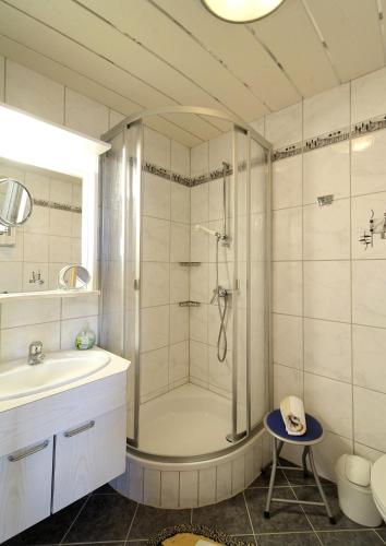 a bathroom with a shower and a sink at Pension / FW Gästehaus Stern in Bodenmais