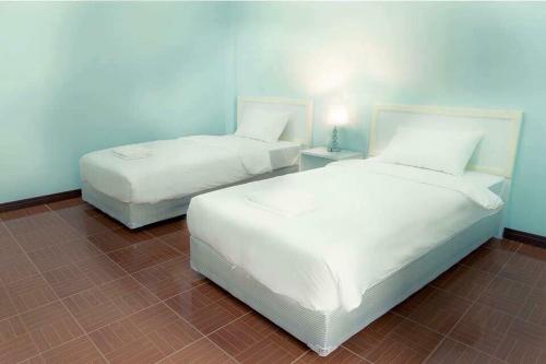 Postel nebo postele na pokoji v ubytování The One Place Prasat