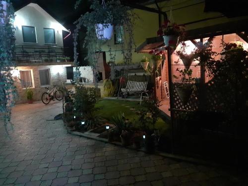 a courtyard of a house at night at Vila Amy in Năvodari