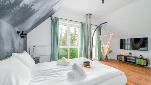 מיטה או מיטות בחדר ב-Wonder Home - Domki górskie wolnostojące z prywatnymi tarasami - zielona okolica