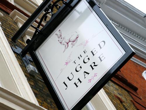 a sign for a restaurant with a deer on it at Montcalm Brewery Townhouse in London