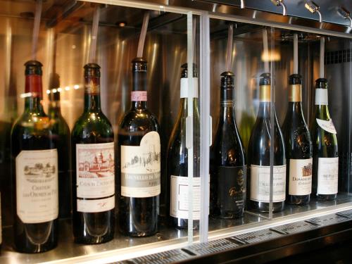 a bunch of bottles of wine on a shelf at Montcalm Brewery Townhouse in London