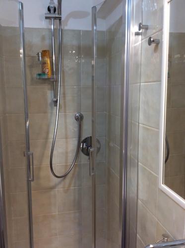 a shower in a bathroom with a glass shower stall at Pieds dans l'eau à Portofino by PortofinoVacanze in Portofino