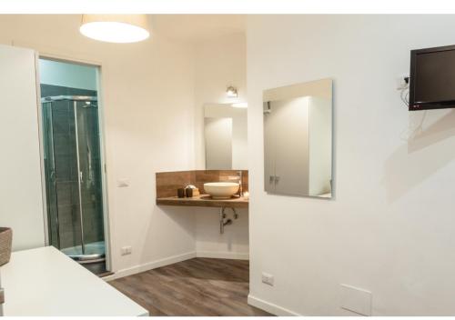a bathroom with a sink and a mirror at Infinity Castle in Rome
