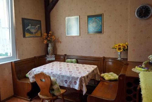 a dining room with a table and a table and chairs at Baia del Re da joli e Amedeo Lago Maggiore in Minusio