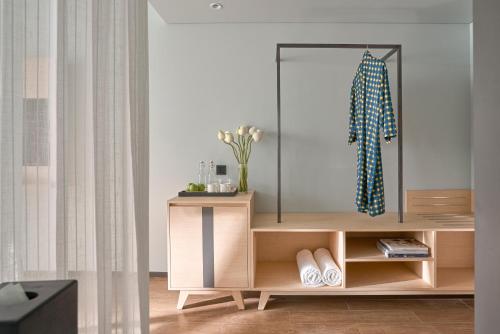 a dressing table with a mirror in a room at The Secret Con Dao in Con Dao