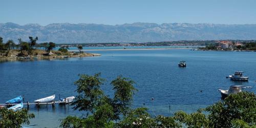 a group of boats on a large body of water at Seaview Holiday Apartments, Ventura Nin in Nin