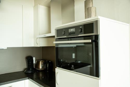 Η κουζίνα ή μικρή κουζίνα στο Bed & Beach Sydney