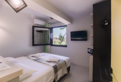 Ένα ή περισσότερα κρεβάτια σε δωμάτιο στο Bikini Apartments