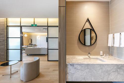 a bathroom with a sink and a mirror at Brown Dot Hotel Ulsan Jangsaengpo in Ulsan