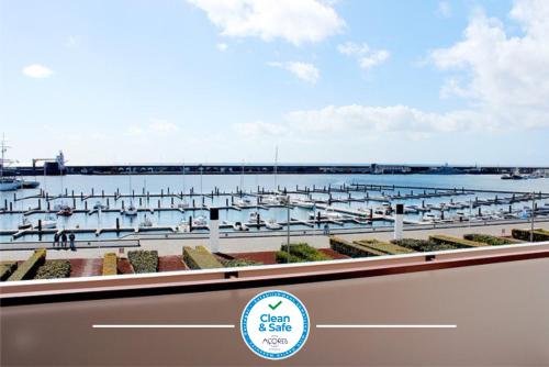 a view of a marina with boats in the water at Solmar Alojamentos in Ponta Delgada