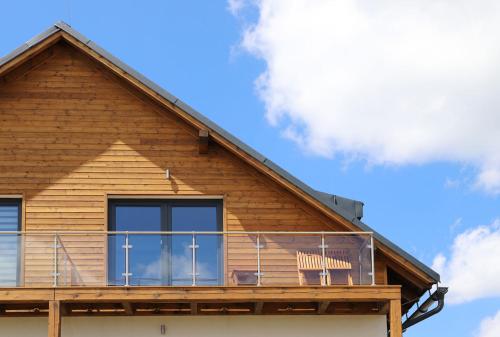 a deck on the side of a house at SCANDIC Apartments Boží Dar in Boží Dar