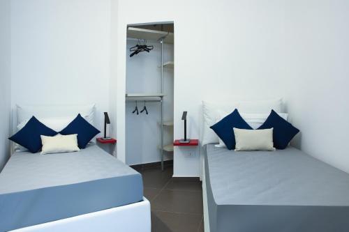 Ένα ή περισσότερα κρεβάτια σε δωμάτιο στο Hotel Sporting Club
