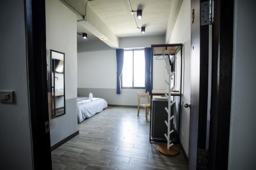 Postel nebo postele na pokoji v ubytování จ้าวหอม บูทิก โฮเทล