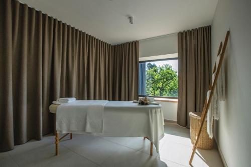 a room with a table in front of a window at Hotel Park - Sava Hotels & Resorts in Bled