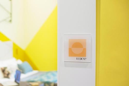 a sign on a door in a room at Mediterra in Castellammare di Stabia
