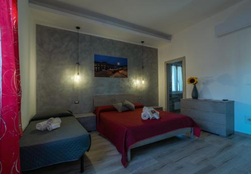 Postel nebo postele na pokoji v ubytování R&B mediterraneo