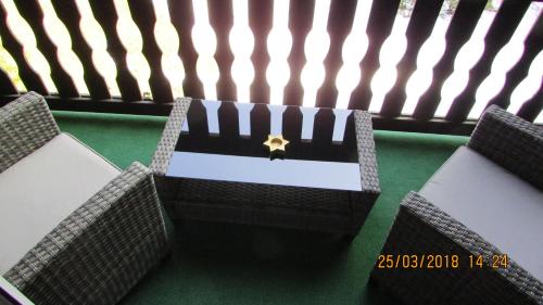 a minecraft room with two chairs and a box at Finnhaus Neubauer in Elbingerode