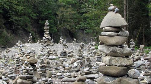 a group of stacks of rocks on a road at Gästehaus Fritz in Mittelberg