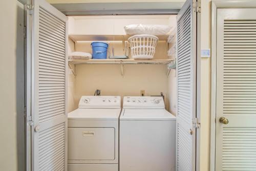a small laundry room with a washer and dryer at Tarpon 10 in Panama City Beach