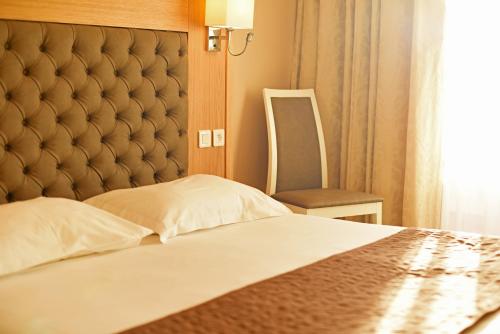 Ένα ή περισσότερα κρεβάτια σε δωμάτιο στο Hotel Tettola