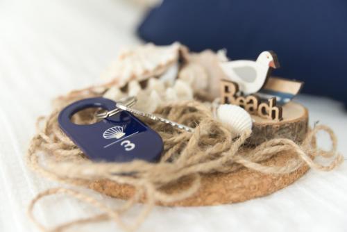 a pair of keys sitting on top of a piece of bread at Portofino Seaside Apartments in Międzyzdroje