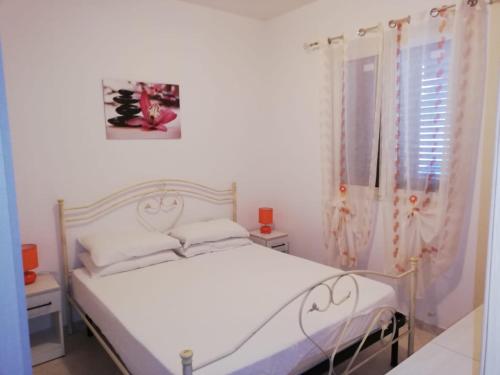 En eller flere senge i et værelse på Bilocale Savonarola