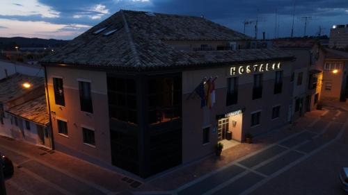 a building with a sign for a restaurant at night at Buenavista in Cuenca