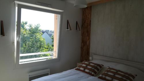 Кровать или кровати в номере Appartement l'Estivalière face à la mer