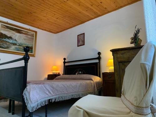 a bedroom with two beds and a fireplace at Casa di Giulietta in Bomarzo