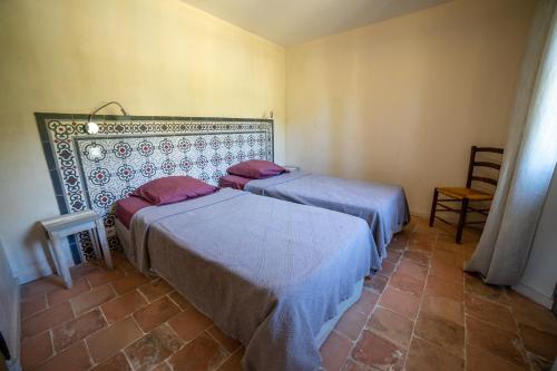 Letto o letti in una camera di Domaine Les Perpetus