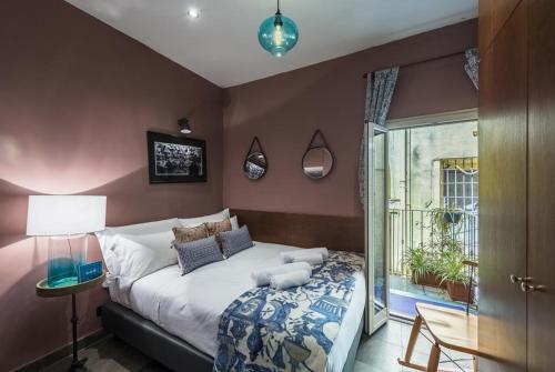 a bedroom with a large bed and a window at Fontana di Trevi Luxury Nest in Rome
