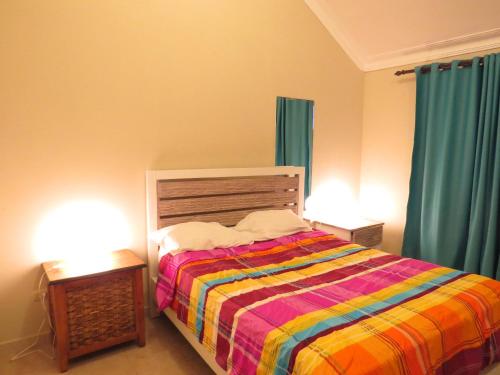 Un pat sau paturi într-o cameră la Corales Punta Cana