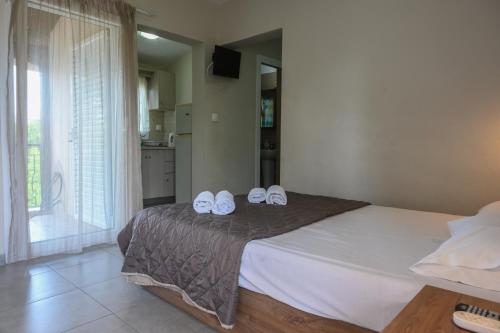 Postel nebo postele na pokoji v ubytování Kalouda Rooms