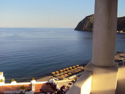 a view of the ocean from a building with a column at Oltremare Residence Hotel in Lipari