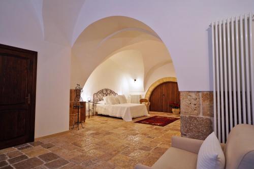 Tempat tidur dalam kamar di Malandrì