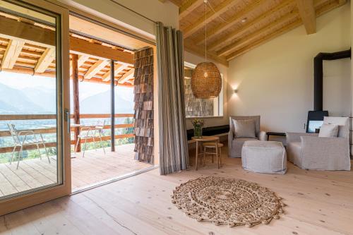 a living room with a view of the ocean at Der Jägersberg in Fischen