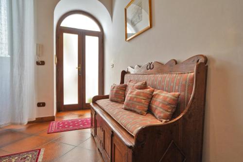 a couch with pillows sitting in a living room at Malandrì B&B in Altamura