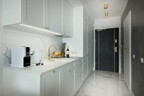 Η κουζίνα ή μικρή κουζίνα στο Luxury Del Sol Apartments Świnoujście