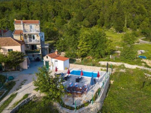 an aerial view of a house with a swimming pool at Villa in Tu epi with Private Swimming Pool in Tučepi