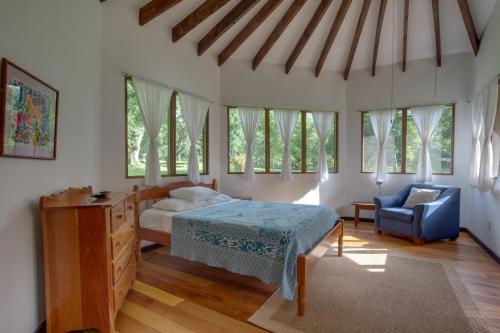 
A bed or beds in a room at Sweet Songs Jungle Lodge
